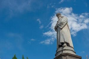 Stutue of Leonardo da Vinci in front of the Teatro alla Scala in Milan photo