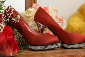 Red heels and bouquet photo