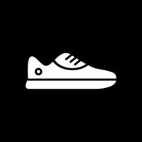 zapatilla de deporte glifo invertido icono diseño vector