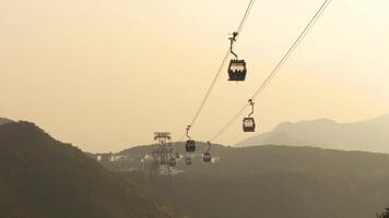 Cable car overhead in backlit sunset light, Hong Kong. Funicular video