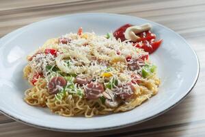 Pizza Instant Noodle served in white Plate photo