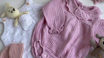 Set of pink clothes and accessories for newborn baby. video