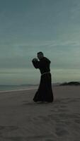 Karate Monk Closure Trains On The Beach Athlete video