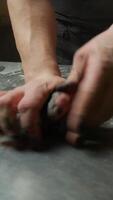 Hands Of Chef Mixing The Dough For Black Squid Ink Spaghetti Pasta Food video