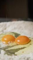 Hand Of Chef Cracking Eggs Into Flour For Dough Pasta Tagliatelle video