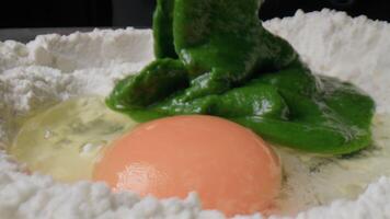 Adding Basil Pesto to Egg Flour for Tagliatelle Pasta video