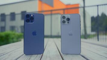 RUSSIA, MOSCOW - SEPTEMBER 27, 2021. Comparison of iPhones. Action. External design of line of iPhones from Apple company. Comparison of cameras and sizes of two iPhones video