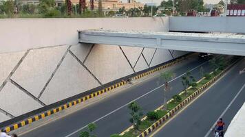 Neat and clean traffic passing from underpass in Lahore Pakistan on April 27, 2024 video