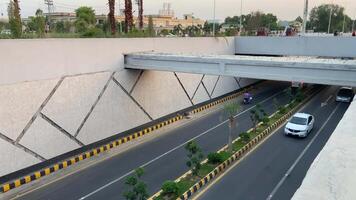 Neat and clean traffic passing from underpass in Lahore Pakistan on April 27, 2024 video