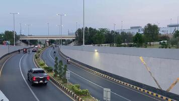 Neat and clean traffic passing from underpass in Lahore Pakistan on April 27, 2024 video