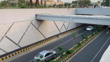 Neat and clean traffic passing from underpass in Lahore Pakistan on April 27, 2024 video