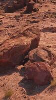 A rock formation in the middle of a desert video