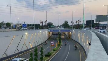 Neat and clean traffic passing from underpass in Lahore Pakistan on April 27, 2024 video