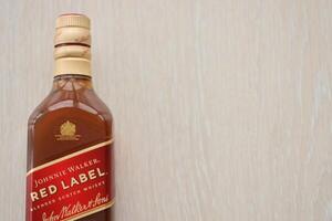 KYIV, UKRAINE - NOVEMBER 27, 2023 Johnnie Walker red label scotch whisky bottle photo