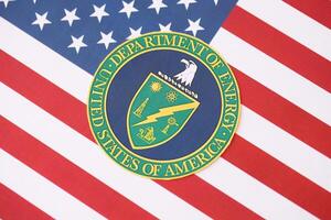 KYIV, UKRAINE - MARCH 9, 2024 US Department of Energy seal on United States of America flag photo