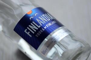 KYIV, UKRAINE - FEBRUARY 27, 2024 Bottle of famous Finlandia vodka alcohol drink on table photo