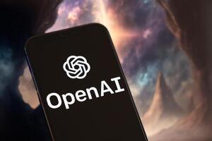 KYIV, UKRAINE - MARCH 17, 2024 OpenAI logo on iPhone display screen with background of artificial intelligence futuristic image photo