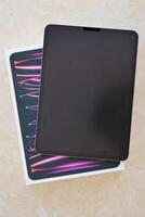 KYIV, UKRAINE - 4 MAY, 2023 Apple ipad 2022 with 12.9 inch diagonal display resolution on m2 processor core photo