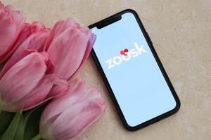 KYIV, UKRAINE - FEBRUARY 23, 2024 Zoosk logo of famous dating website or app on iPhone display photo