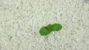 top view of white rice on rotary display. video