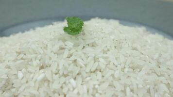 top view of white rice on rotary display. video