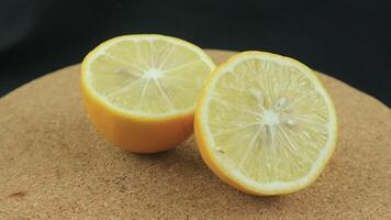 Lemon slices with mint leaf rotation background. Close-up of a delicious ripe lemon rotate and aromatic mint. Healthy food, cooking ingredient. video