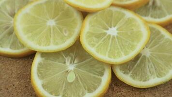 Lemon slices with mint leaf rotation background. Close-up of a delicious ripe lemon rotate and aromatic mint. Healthy food, cooking ingredient. video