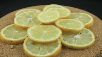 Lemon slices with mint leaf rotation background. Close-up of a delicious ripe lemon rotate and aromatic mint. Healthy food, cooking ingredient. video