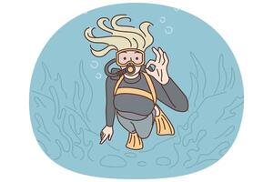 Woman diver swims underwater in scuba gear and goggles showing OK gesture exploring underwater world vector