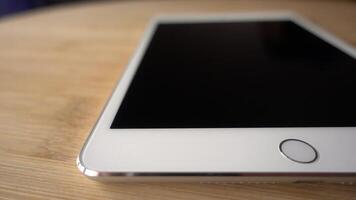 White Tablet or I pad Rotates video