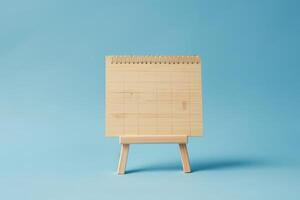 AI generated Wooden calendar on blue background for International Picnic and Panic Day. photo