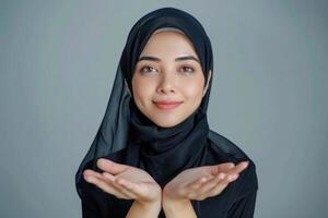 AI generated Asian Muslim woman presenting product with hands in empty space. photo