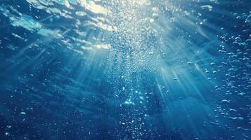 AI generated Blue ocean waves from underwater with bubbles. Light rays shining through. Great for backgrounds. photo