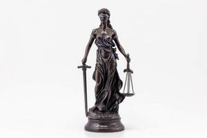 AI generated Themis with scale and sword isolated on white. Justice and law symbol statue photo