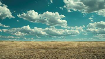 Drought land against a blue sky with clouds Drought land against a blue sky with clouds photo