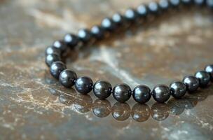 Black pearl necklace closeup photo