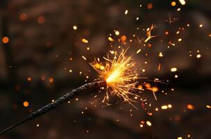 Ignited sparkler in dark photo