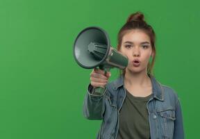 Woman with a bullhorn for news feeds and sales marketing, theme of protecting women's rights and feminism. photo