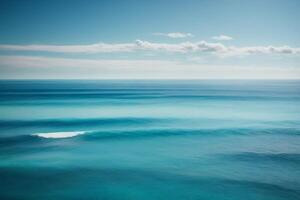 a beautiful sunset over the ocean with waves photo