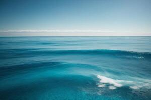 a beautiful sunset over the ocean with waves photo