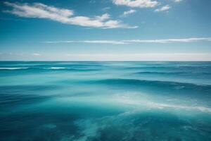 a beautiful blue ocean with waves and clouds photo