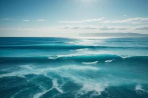 a beautiful blue ocean with waves and clouds photo