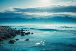 a beautiful blue ocean with waves and clouds photo