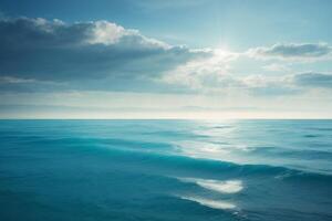 a beautiful blue ocean with waves and clouds photo