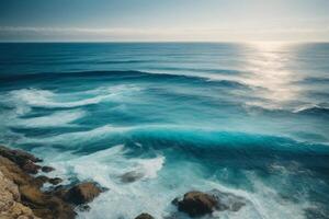 a beautiful blue ocean with waves and clouds photo