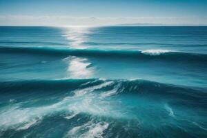 a beautiful blue ocean with waves and clouds photo