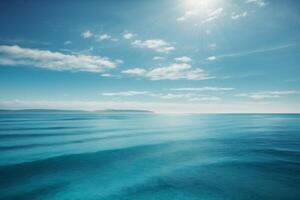 blue ocean with mountains and clouds photo