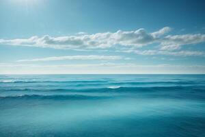 blue ocean with mountains and clouds photo