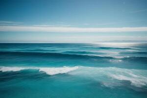 blue ocean with mountains and clouds photo