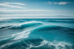 blue ocean with mountains and clouds photo